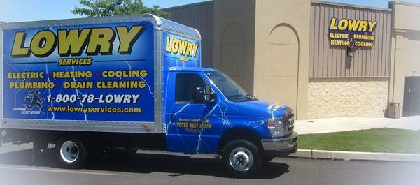 Lowry Services Truck in front of building